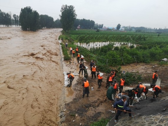 The Weekend Leader - Death toll from floods in China's Henan reach 302