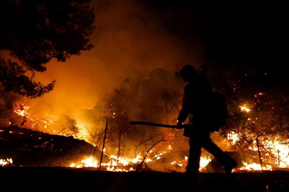 The Weekend Leader - Massive California wildfire rages unabated
