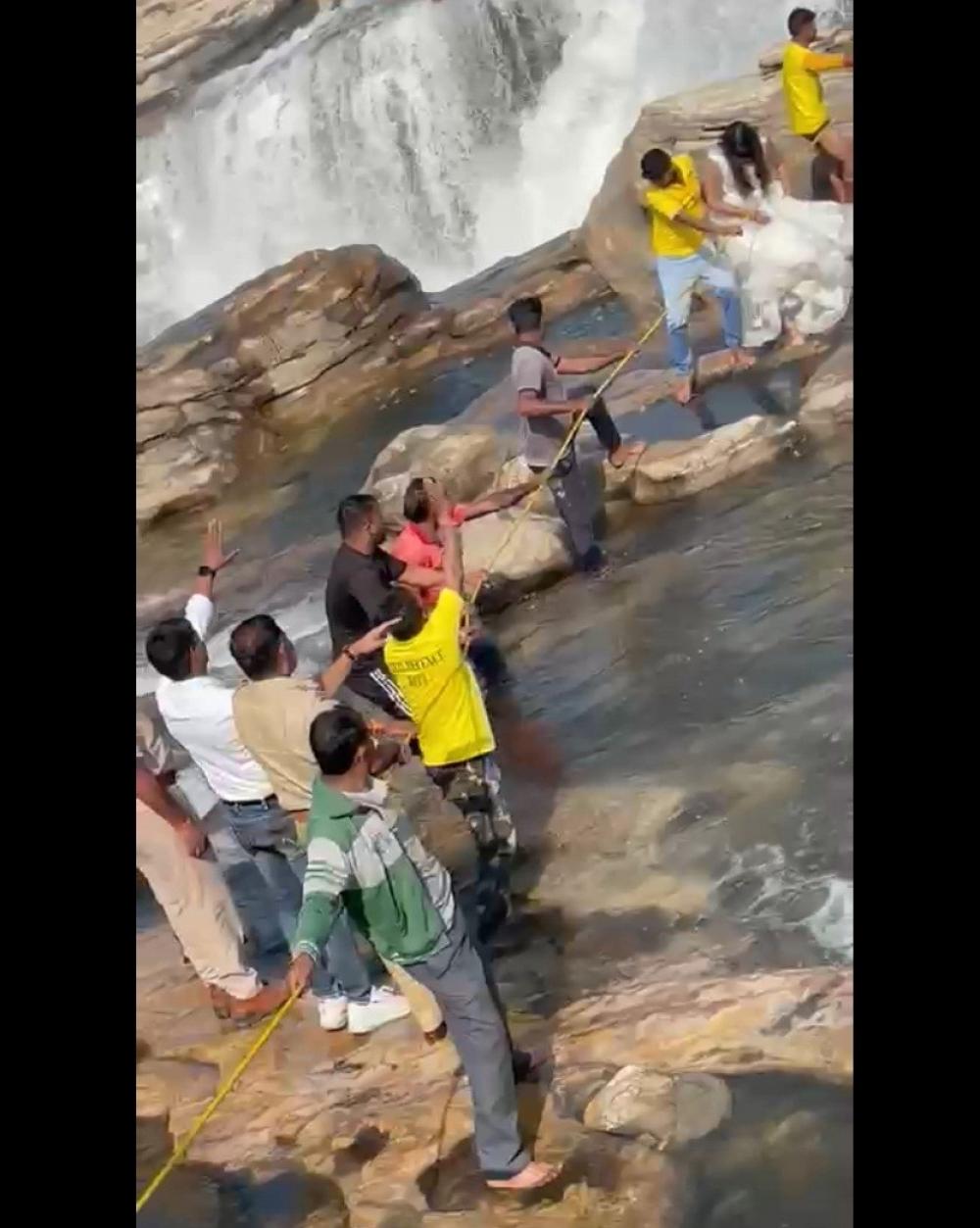 The Weekend Leader - Couple gets stuck in waterfall during pre-wedding shoot, video goes viral