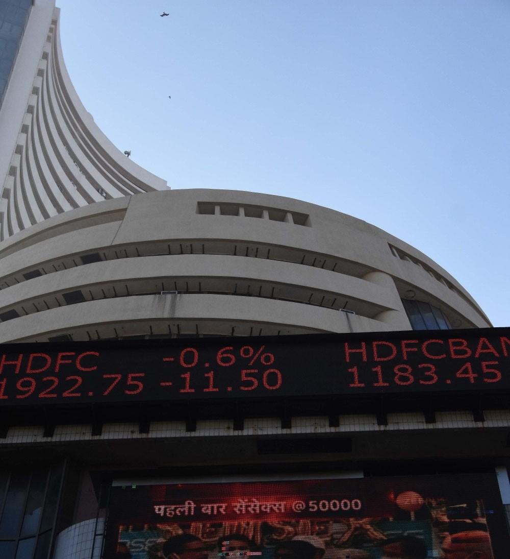 The Weekend Leader - Sensex, Nifty turn flat after touching new highs