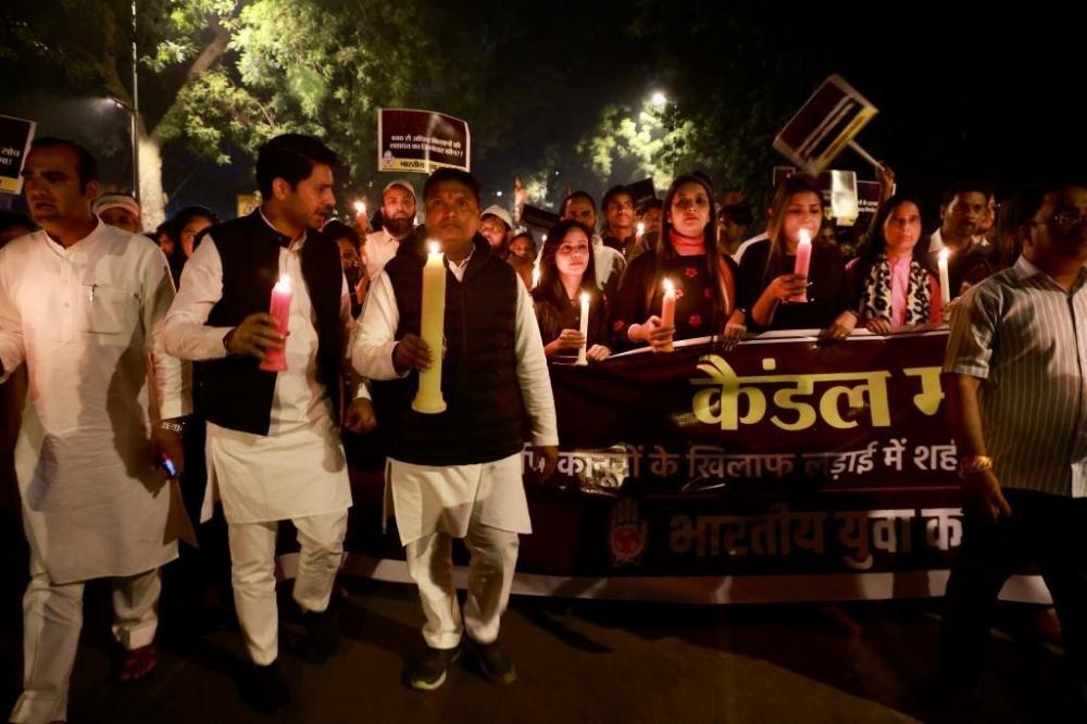 The Weekend Leader - Youth Cong's candle-light march pays tribute to farmers