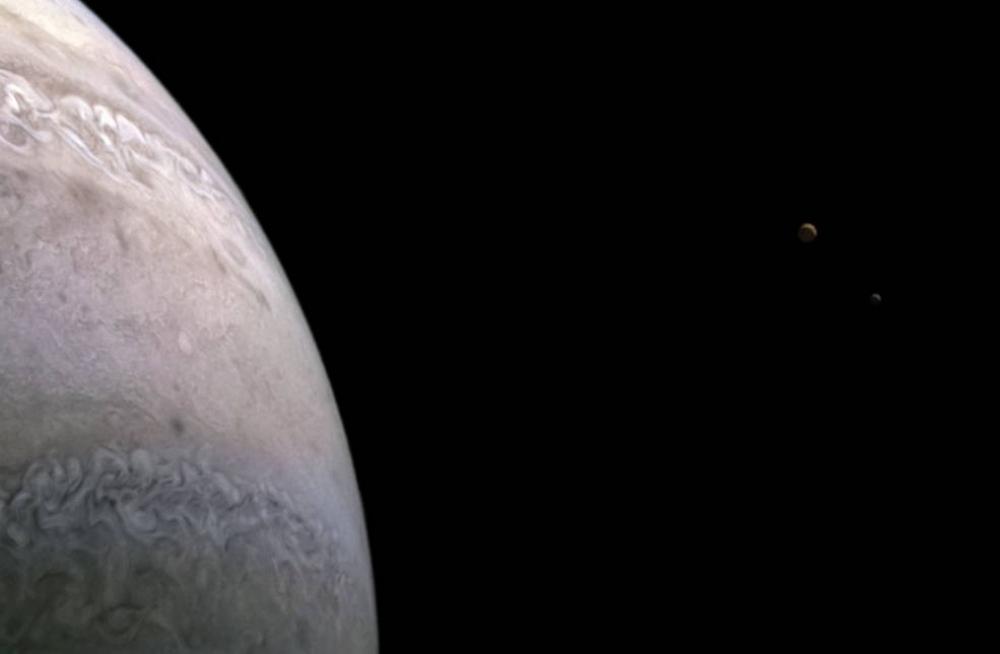 The Weekend Leader - NASA spacecraft snaps images of Jupiter's moons Io, Europa