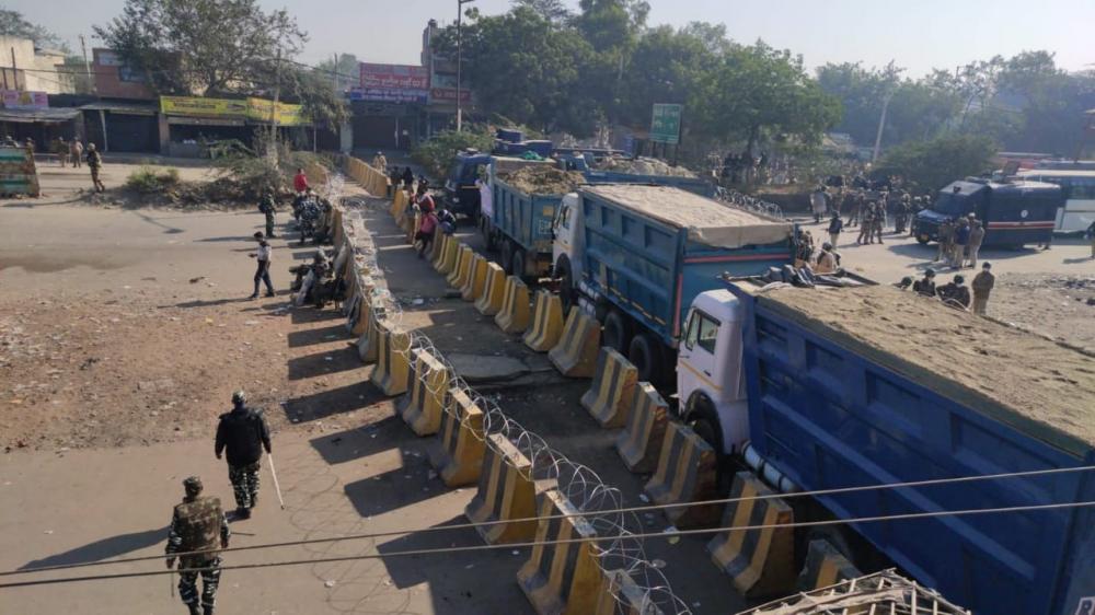 The Weekend Leader - Tear gas shells used to disperse protesters at Singhu border