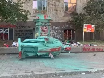 Statue toppled in Canada amid calls to rename varsity