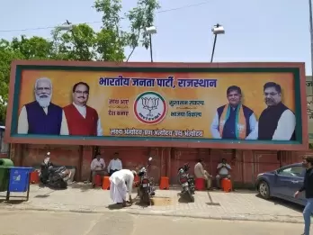 Raje's photo goes missing from BJP posters