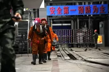 Over 1,000 rescuers sent to save 14 people trapped in China tunnel