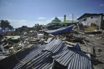 6.1-magnitude quake in Indonesia triggers small tsunami, damages houses
