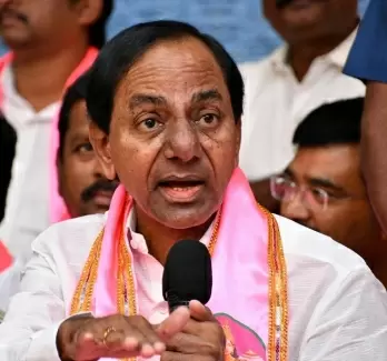 Collector draws ire for touching Telangana CM's feet